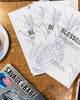 90 Days Guided Journals on a table with a macbook pro laptop 